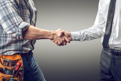 goal-driven hvac sales team member shaking hands with a businessman